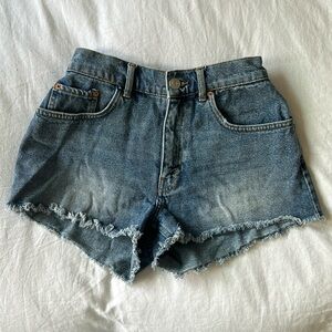 Dark blue denim mini shorts with raw hem